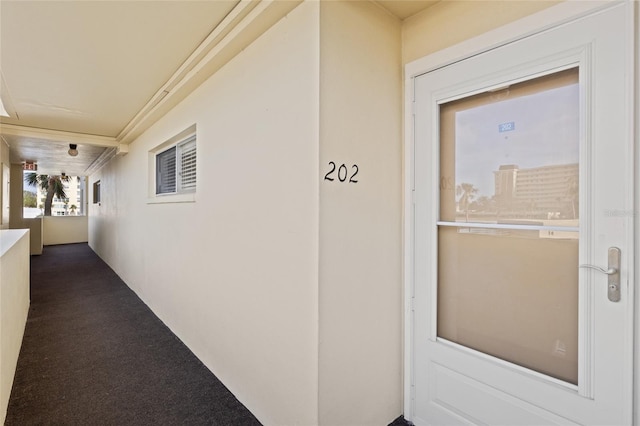 entrance to property with a balcony