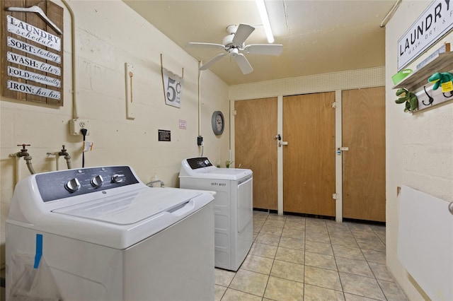 clothes washing area featuring ceiling fan, separate washer and dryer, and light tile patterned floors