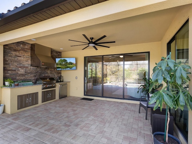 view of patio with an outdoor kitchen, a grill, and ceiling fan