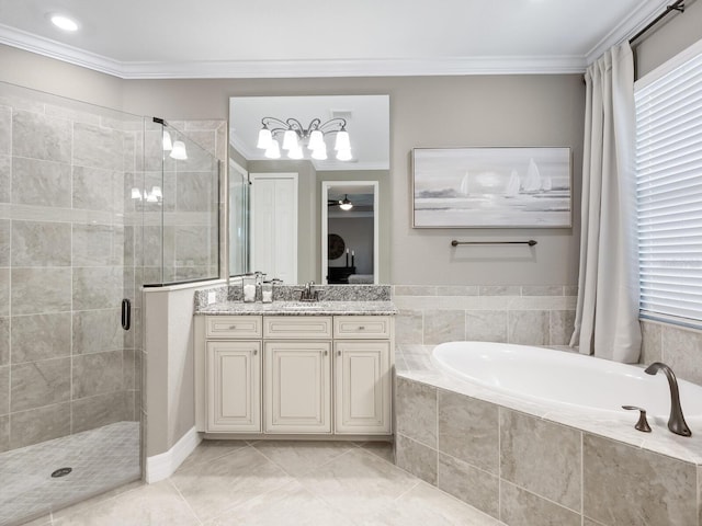 bathroom with tile patterned flooring, ornamental molding, separate shower and tub, and vanity