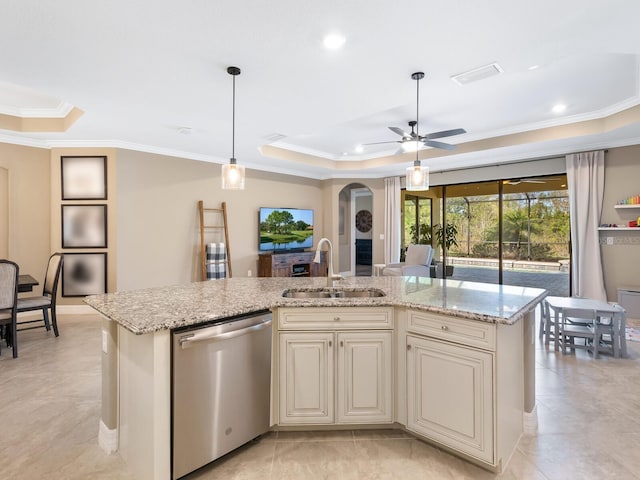 kitchen with stainless steel dishwasher, a raised ceiling, sink, and a center island with sink