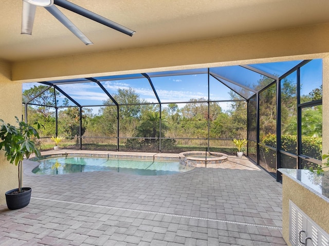 17459 Hickok Belt Loop, Bradenton, FL 34211 - view of pool featuring a pool with connected hot tub, a patio area, and glass enclosure