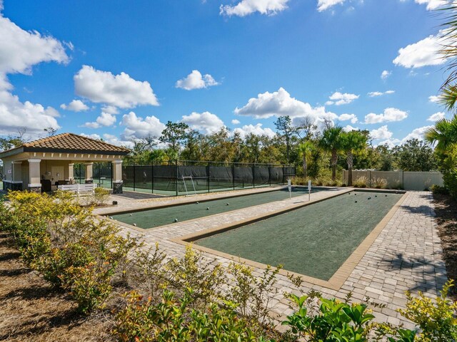 17459 Hickok Belt Loop, Bradenton, FL 34211 - view of property's community with a bocce ball area and fence