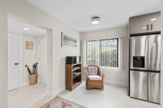 living area with light tile patterned flooring