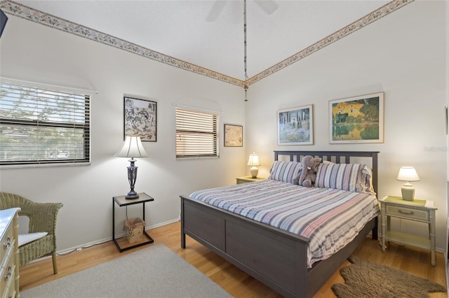 bedroom featuring ceiling fan and light hardwood / wood-style flooring