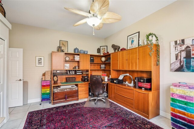 office space with ceiling fan and light tile patterned floors