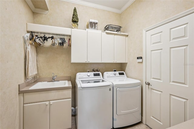 laundry area with separate washer and dryer, sink, crown molding, and cabinets