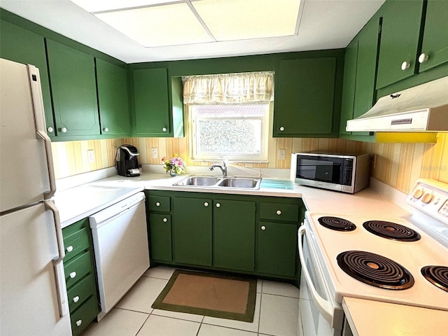 kitchen with sink, white appliances, and green cabinetry