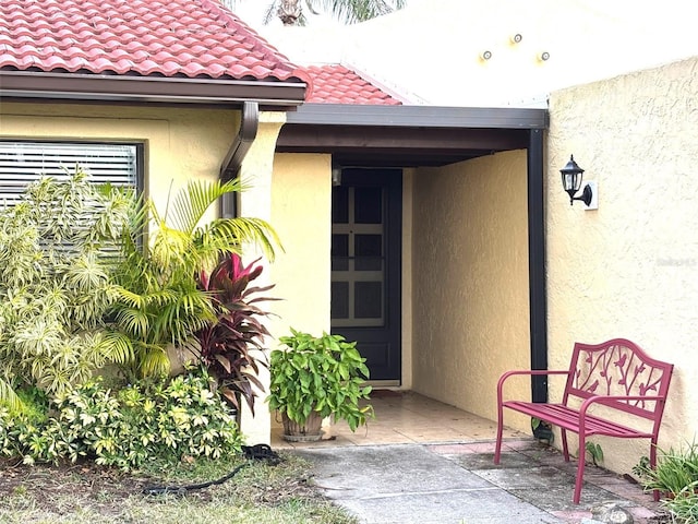 entrance to property with a patio