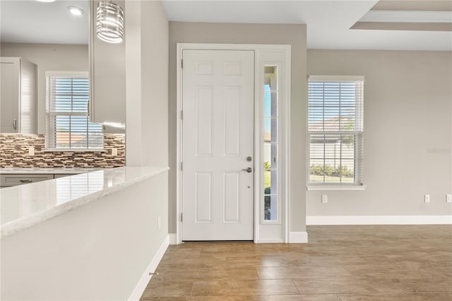 entryway featuring a healthy amount of sunlight and light wood-type flooring