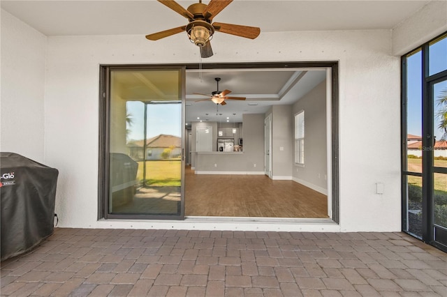 interior space featuring a grill and ceiling fan