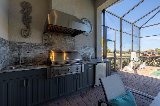 view of patio featuring a sink, a grill, exterior kitchen, and a lanai