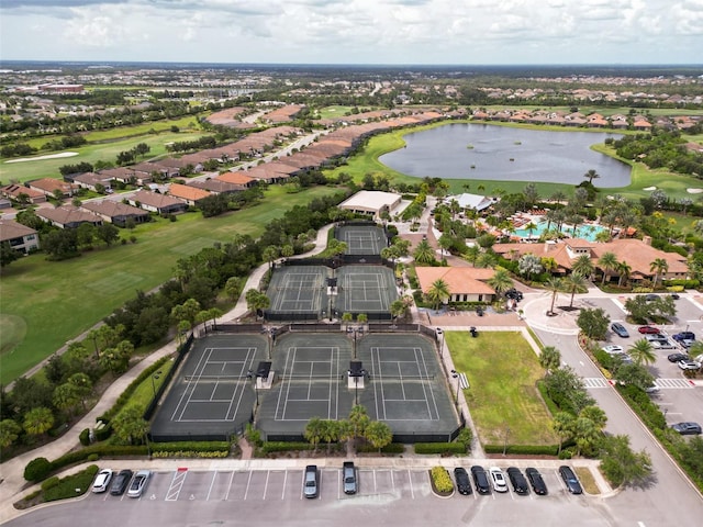 bird's eye view with a water view and view of golf course