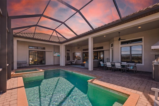view of swimming pool with a patio area, a ceiling fan, an outdoor hangout area, and a pool with connected hot tub