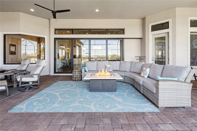 view of patio featuring an outdoor living space with a fire pit