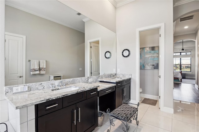 bathroom with visible vents, ornamental molding, toilet, and ensuite bathroom