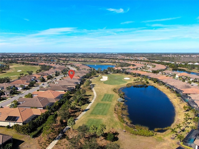 bird's eye view with a water view, a residential view, and golf course view