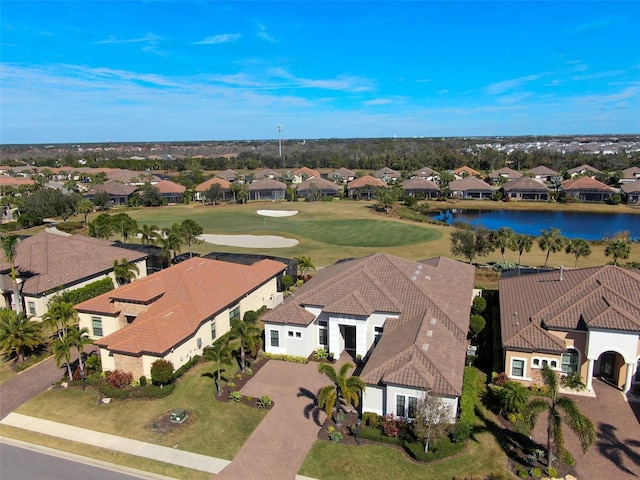aerial view with a water view, golf course view, and a residential view