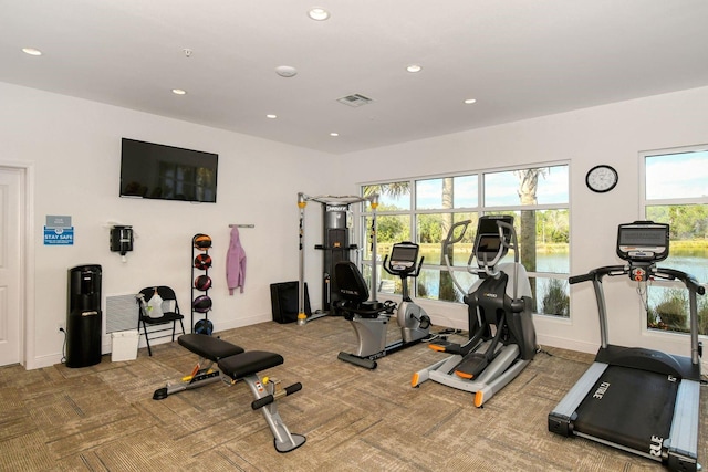 gym with baseboards, carpet floors, and recessed lighting