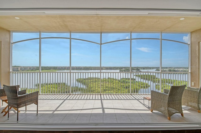 sunroom with a water view