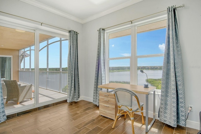 office space featuring a wealth of natural light, wood tiled floor, and a water view