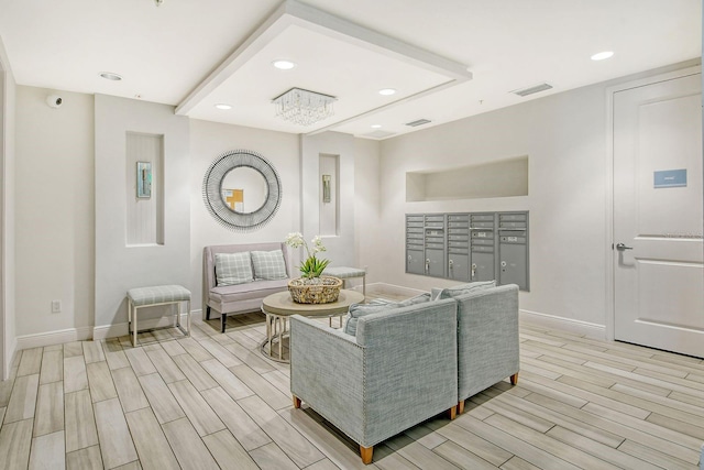 living area featuring recessed lighting, visible vents, mail area, wood tiled floor, and baseboards