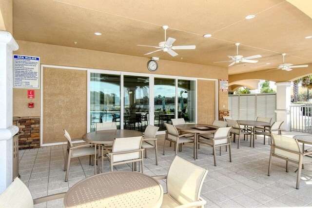 view of patio featuring ceiling fan and outdoor dining space