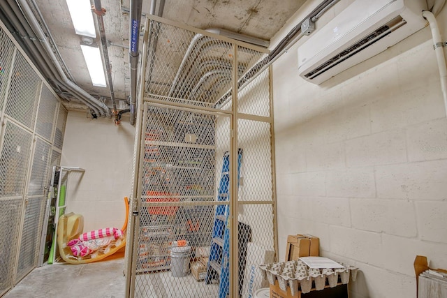 storage room featuring a wall mounted AC