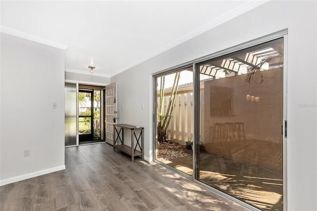 doorway to outside featuring crown molding and hardwood / wood-style flooring