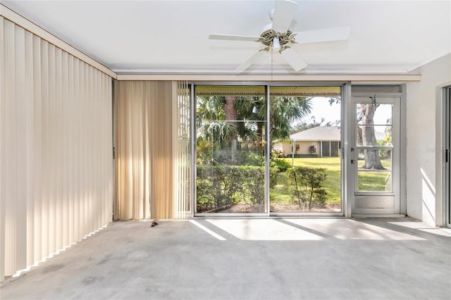 unfurnished room with concrete flooring and ceiling fan