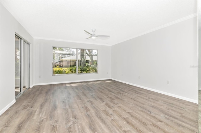 spare room with crown molding, ceiling fan, and light hardwood / wood-style floors