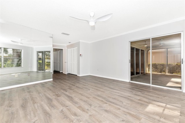 spare room with crown molding, ceiling fan, and light hardwood / wood-style floors