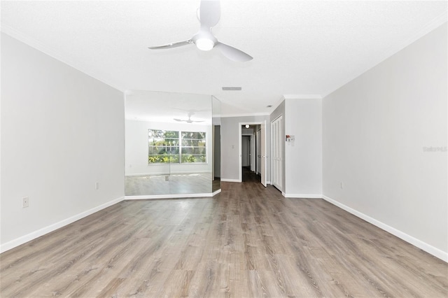 unfurnished room with ornamental molding, a textured ceiling, ceiling fan, and light hardwood / wood-style flooring