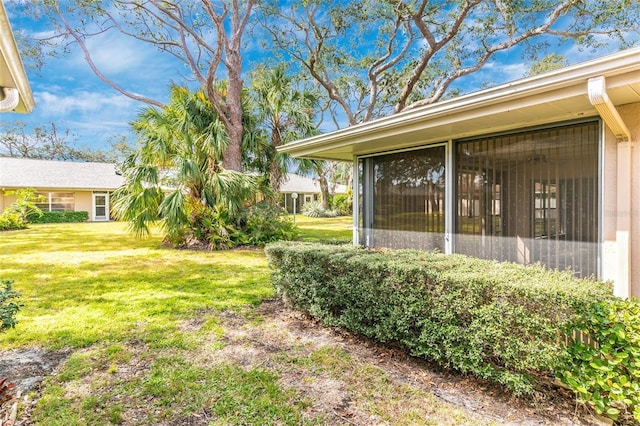 view of yard with a sunroom