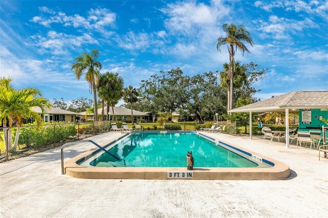 view of swimming pool featuring a patio