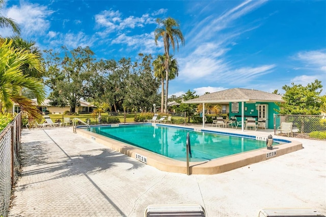 view of swimming pool with a patio area