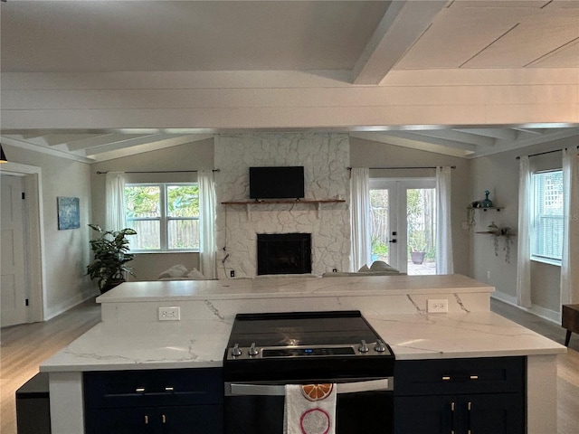 kitchen with light stone counters, electric range oven, and lofted ceiling with beams