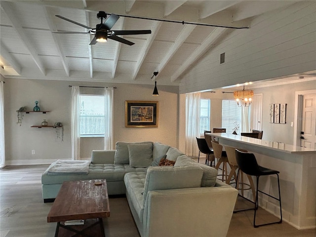 living room with vaulted ceiling with beams, wood-type flooring, and ceiling fan