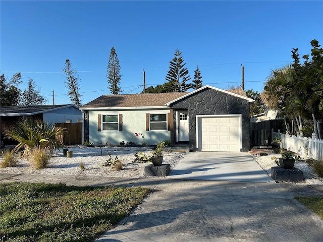 single story home with a garage