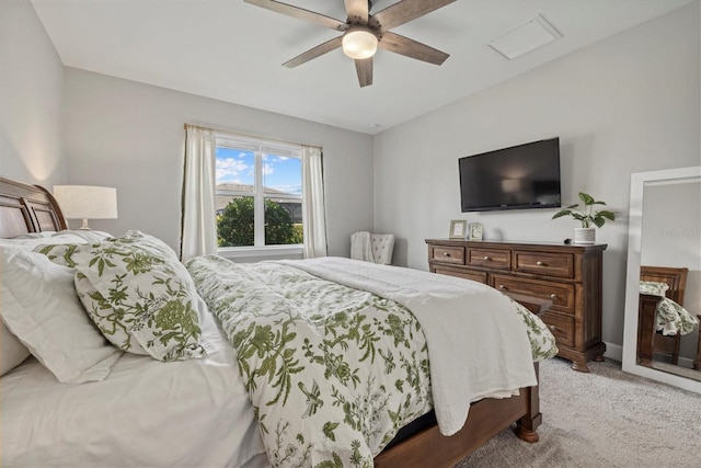 bedroom featuring light colored carpet and ceiling fan