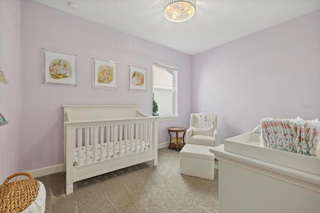 carpeted bedroom with a crib