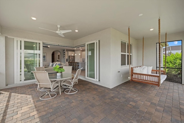 view of patio / terrace with ceiling fan and outdoor lounge area