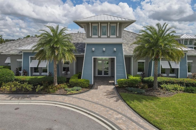 view of front of house featuring french doors and a front yard