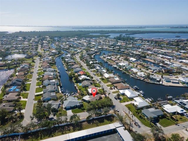 aerial view with a residential view and a water view