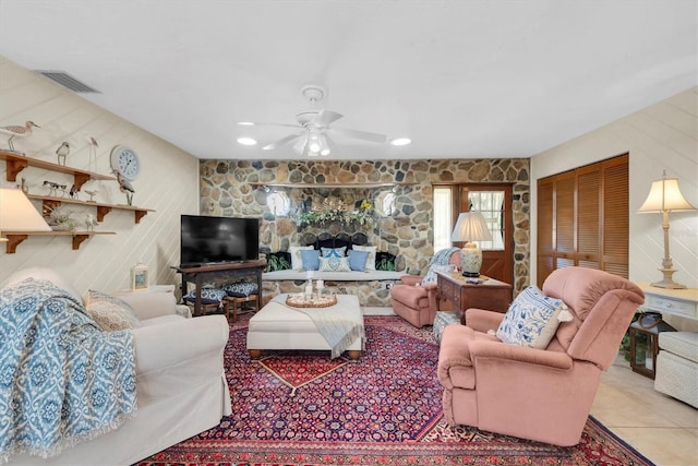 tiled living room featuring ceiling fan