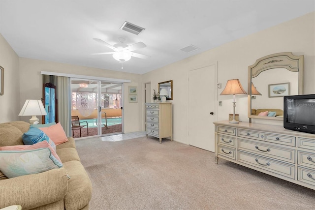 living room with light carpet and ceiling fan