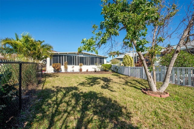 view of yard featuring a sunroom