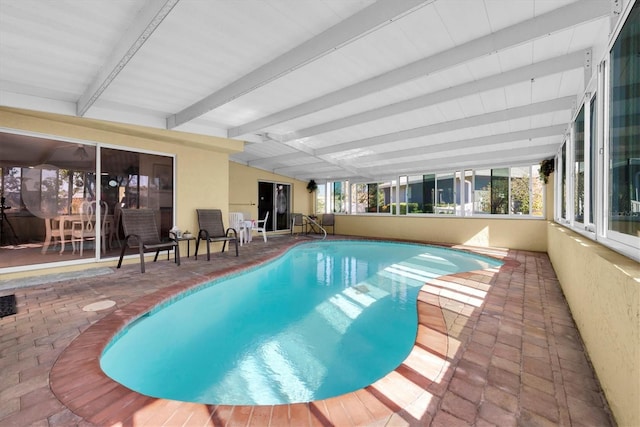 indoor pool with a patio