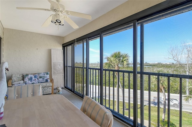 sunroom with ceiling fan and a healthy amount of sunlight