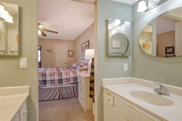 bathroom featuring ceiling fan and vanity